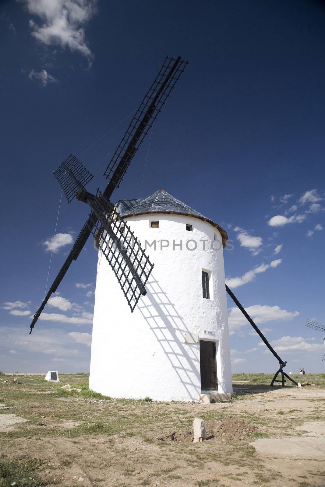 white mill on the country of la mancha in spain