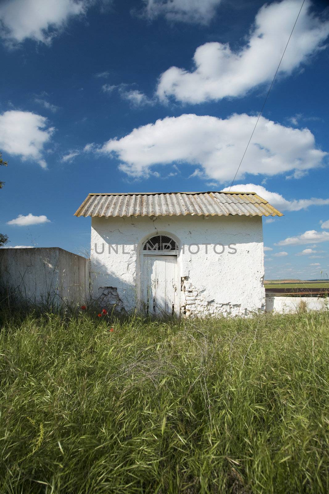 white small house in the countryside of belmonte village