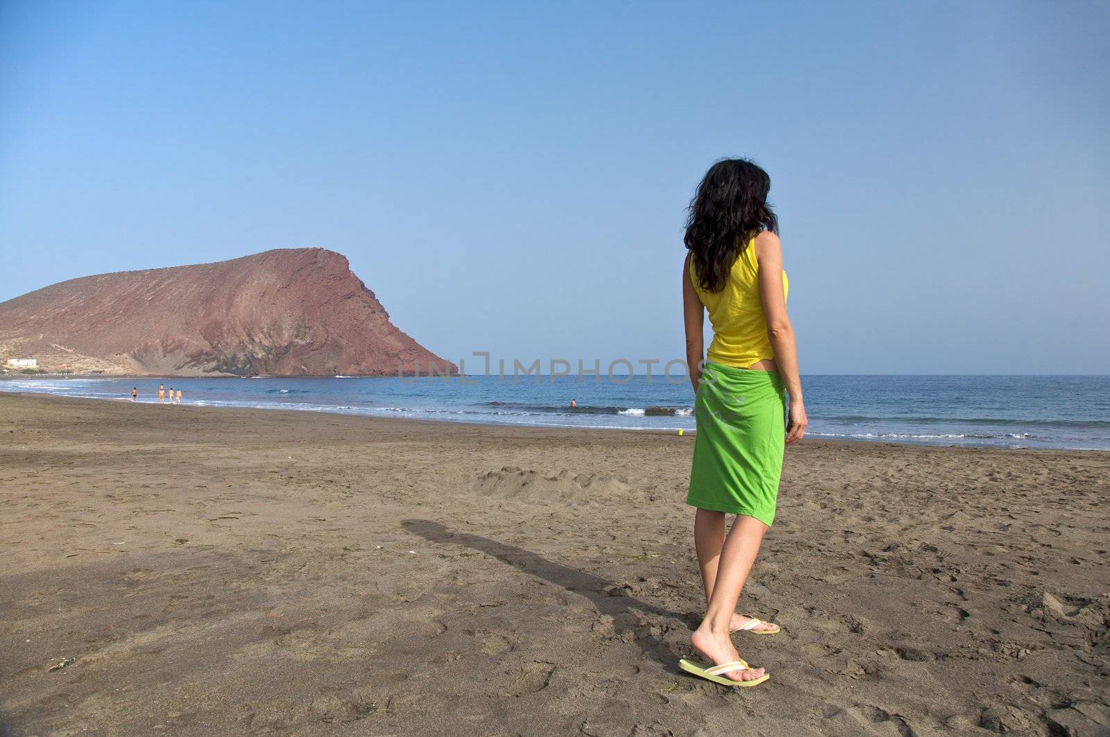 back of a woman at tejita beach tenerife spain