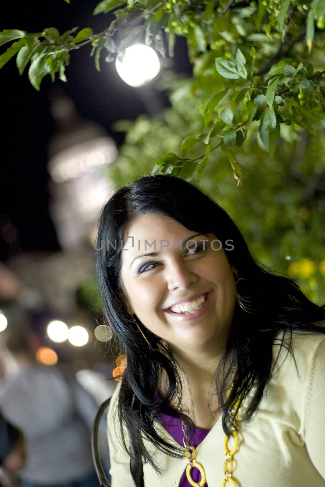 A young brunette enjoying herself in Providence, Rhode Island during the evening.