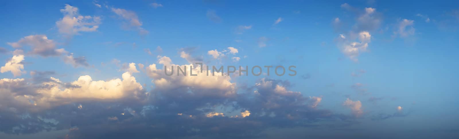 Panaromic view of clouds of a beautiful summer sky. It is almost sunset.