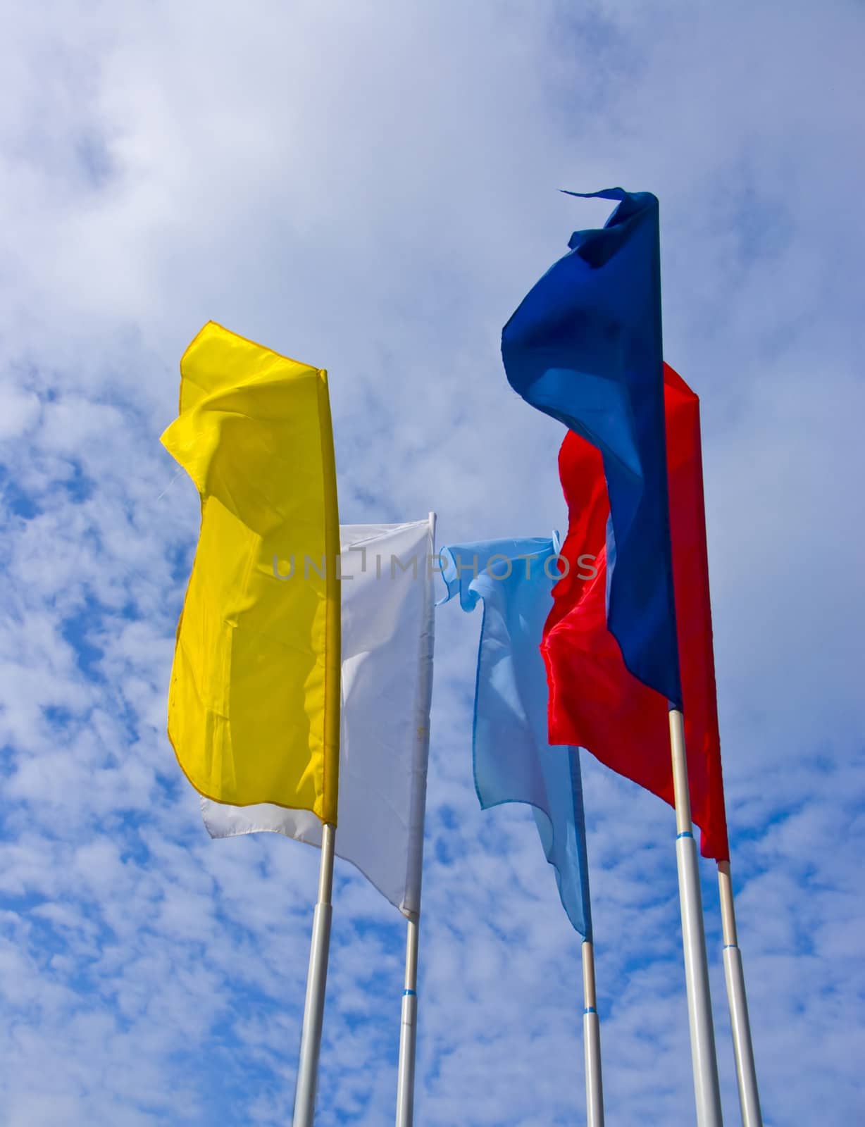 The image of developing flags against the blue sky