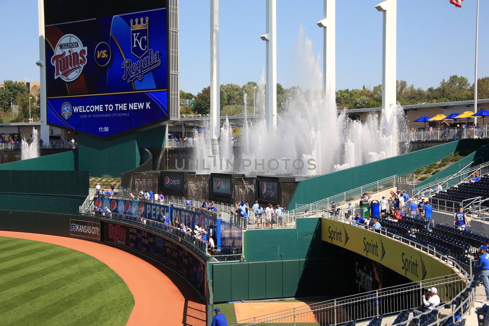 Vintage scoreboard and fountains surrounded by fans at recently remodeled Big K