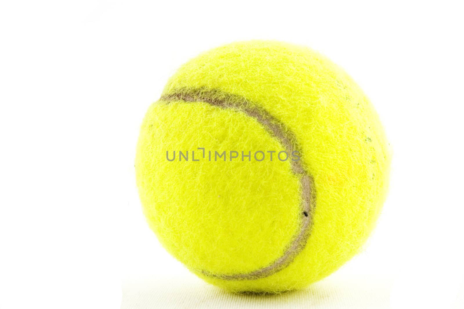 yellow tennisball isolated on a white background by ladyminnie