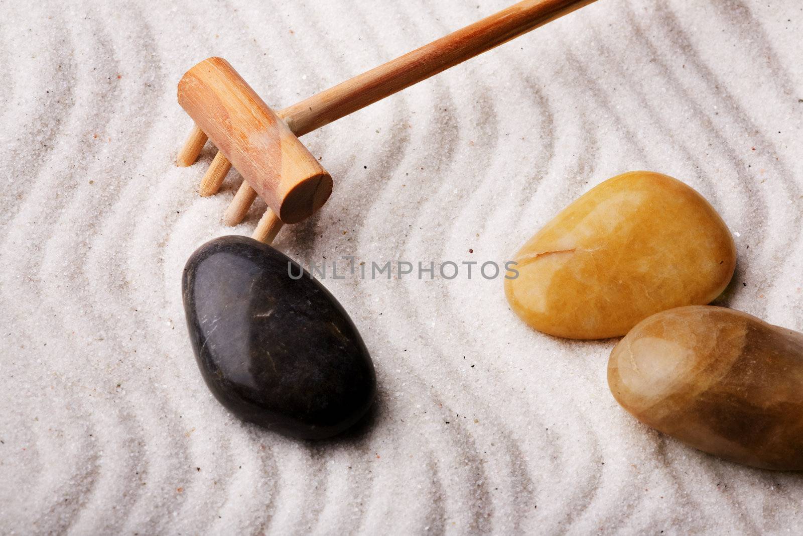 An oriental rock garden background with stones and sand