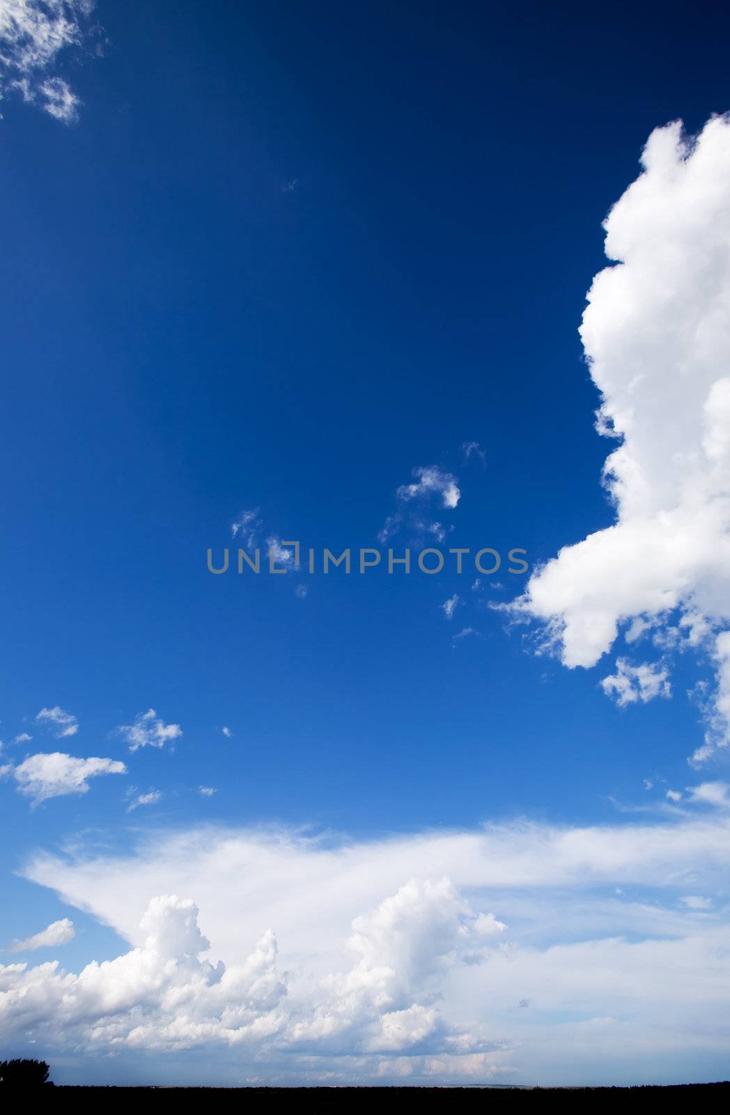 A landscape with a big sky with clouds