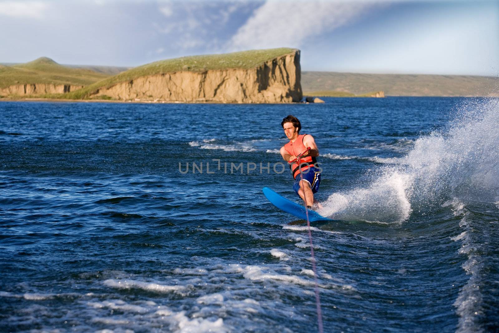 A man water skiing on a lake