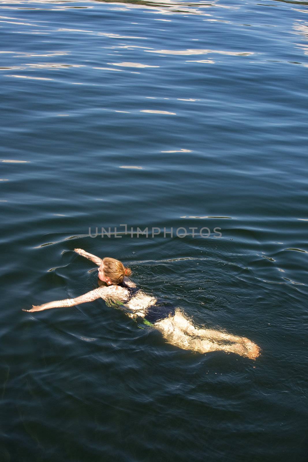 Woman Swimming by leaf