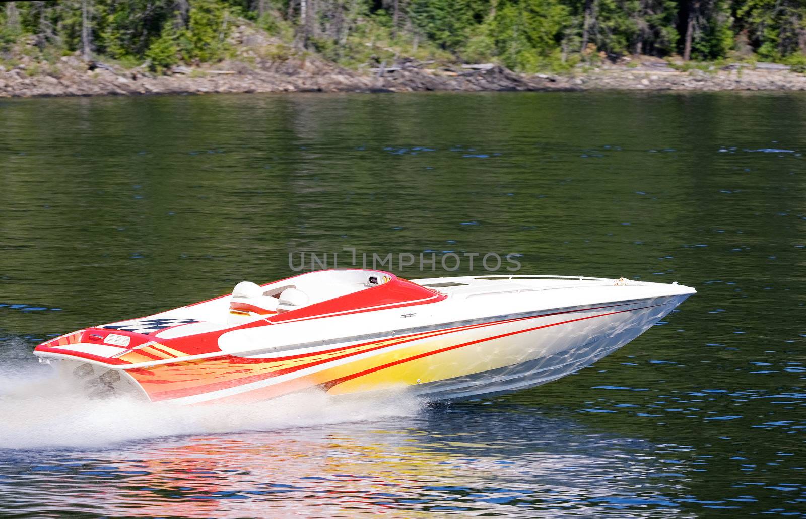 A speedboat on a lake - motion blut on the background with the boat sharp