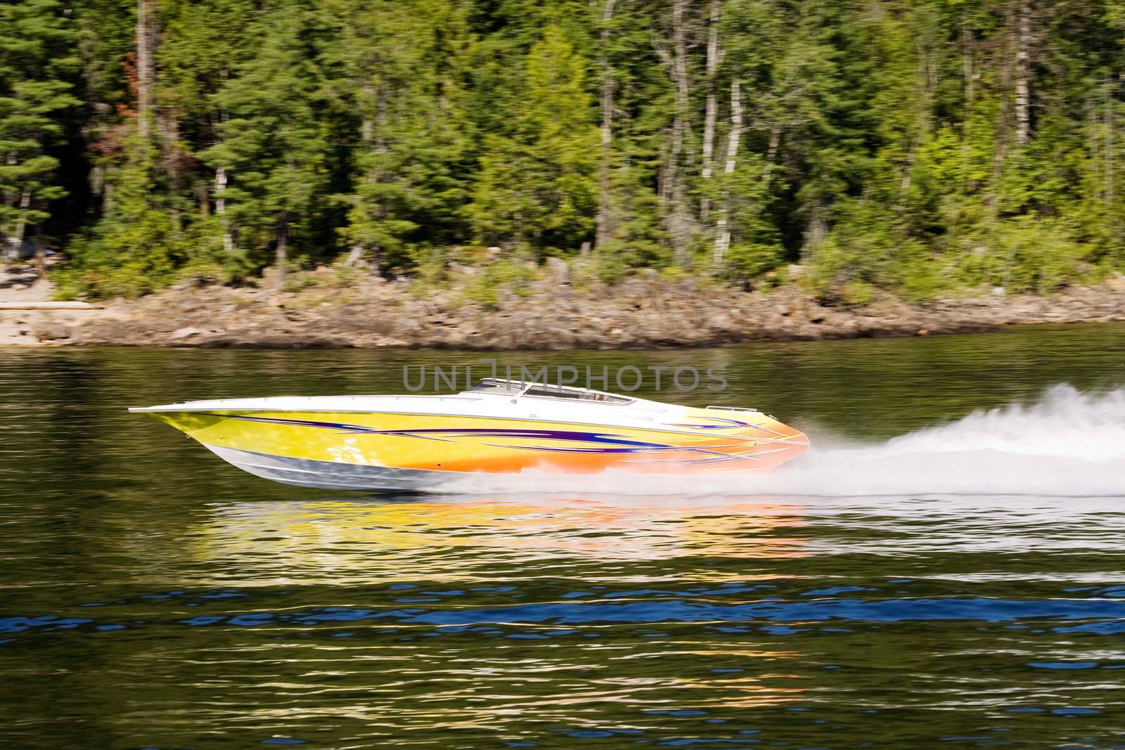 A speedboat on a lake - motion blut on the background with the boat sharp