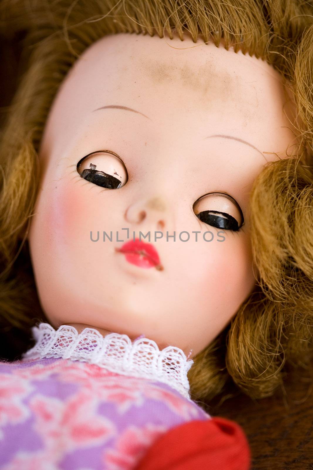 A close up of a doll face - focus on the eyes