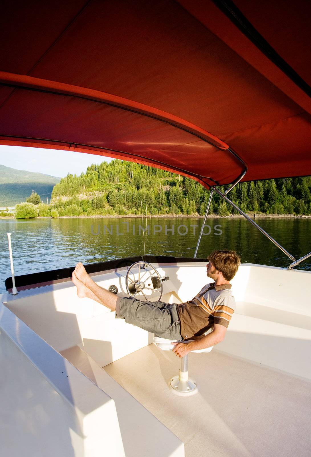 A young male enjoying a luxury boat