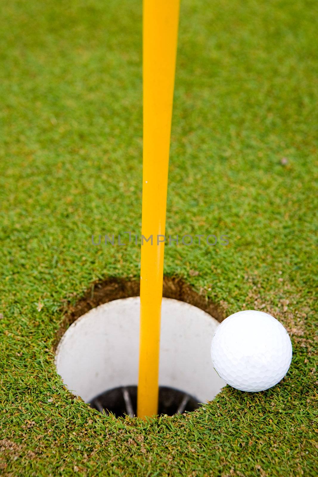 Golf ball very close to going in the hole