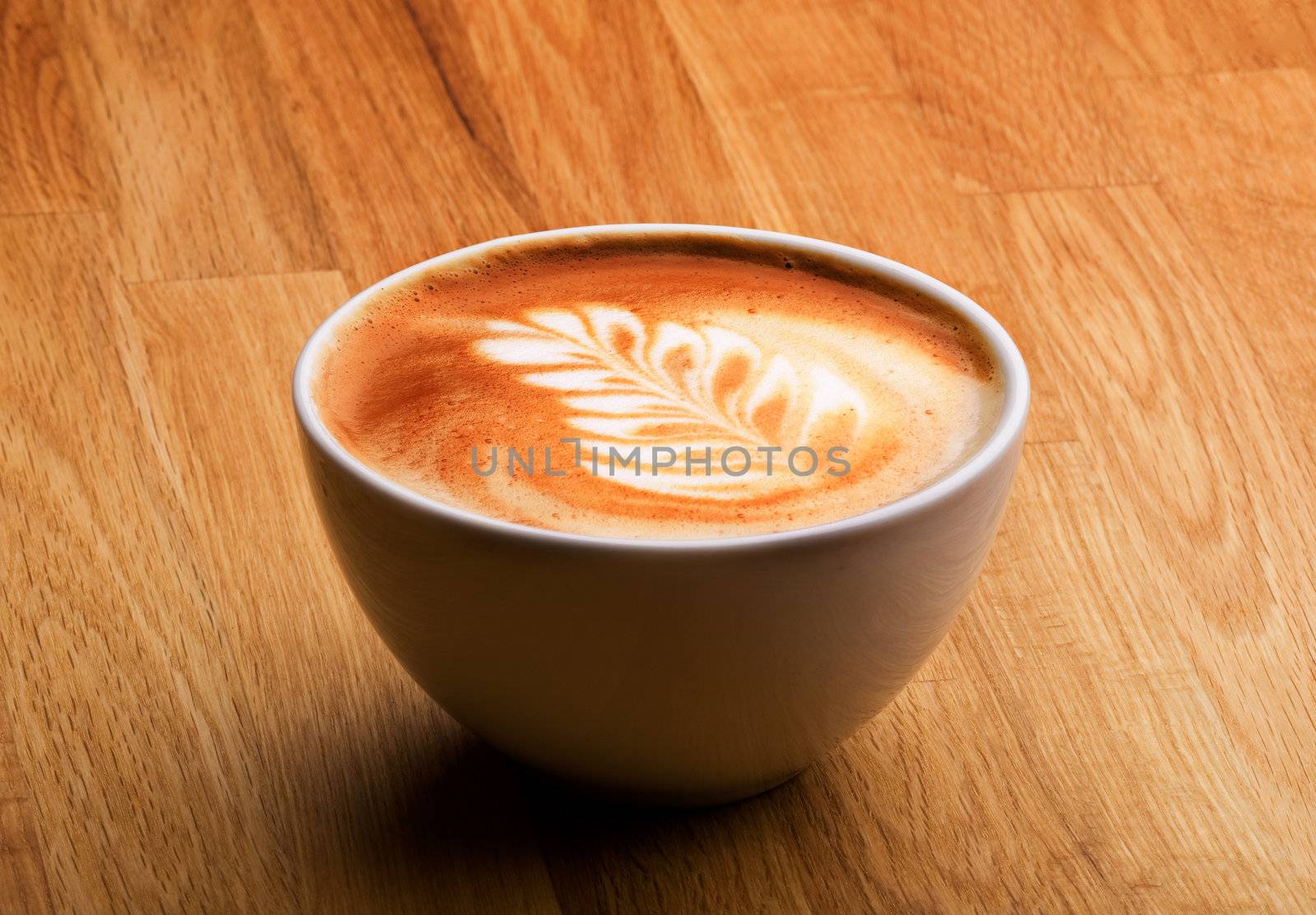 A latte in a bowl with latte art