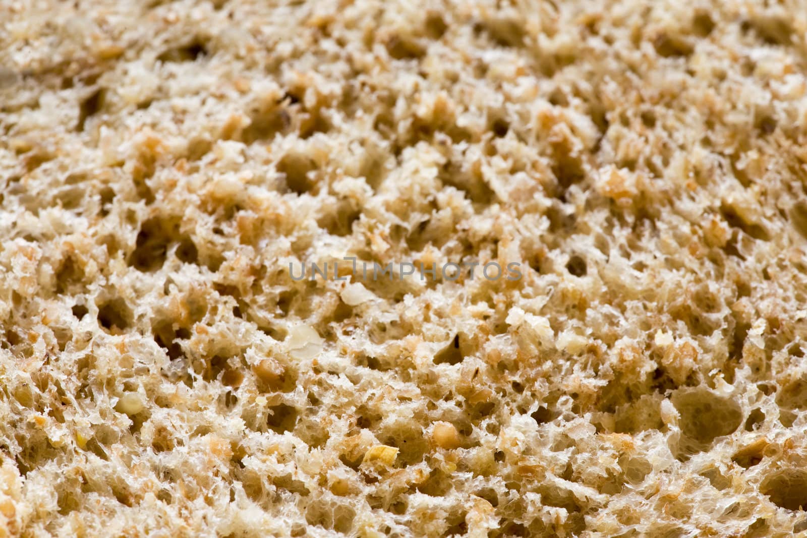 A background texture of freshly sliced brown bread