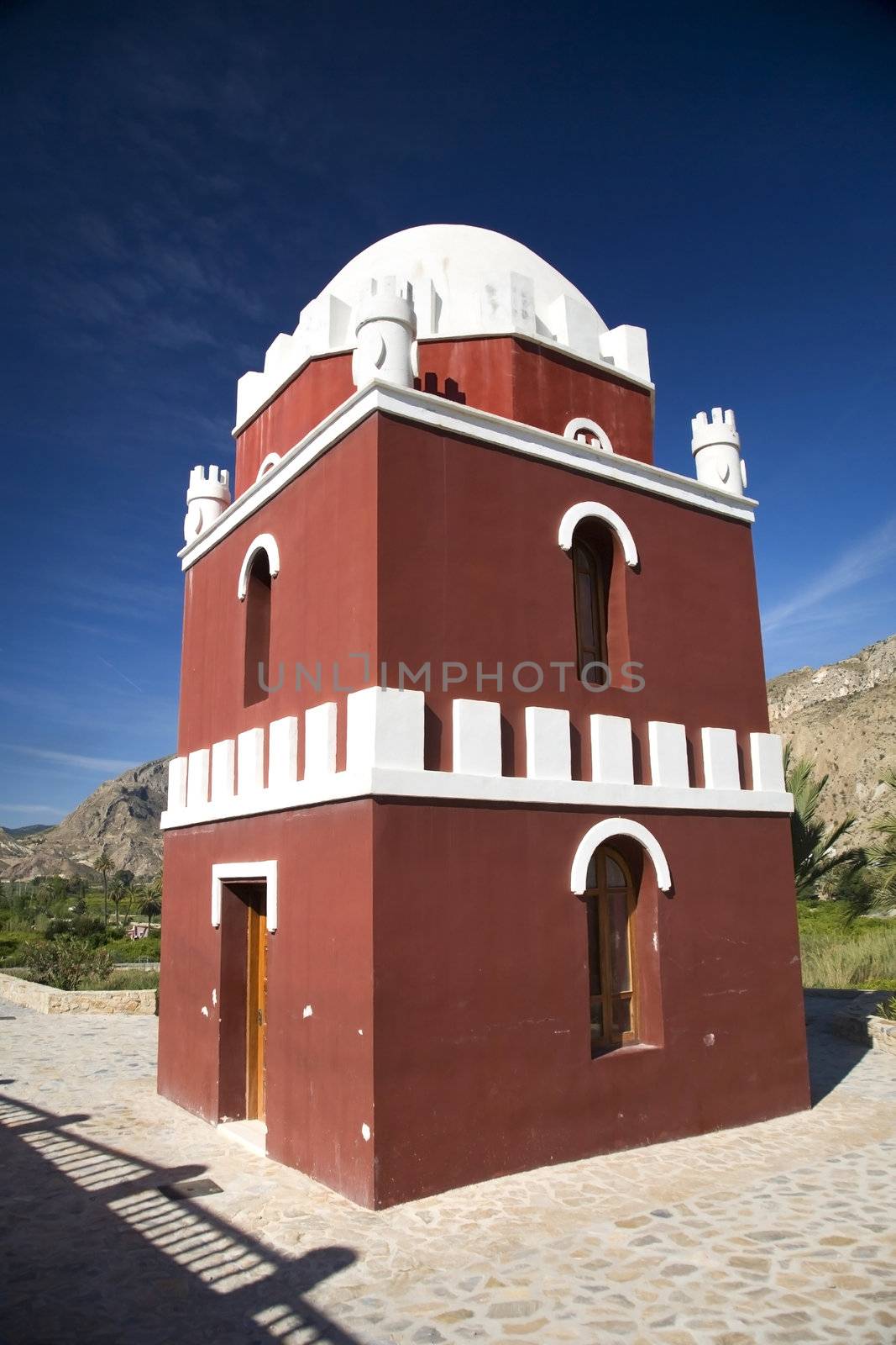 red and white arab tower near murcia in spain