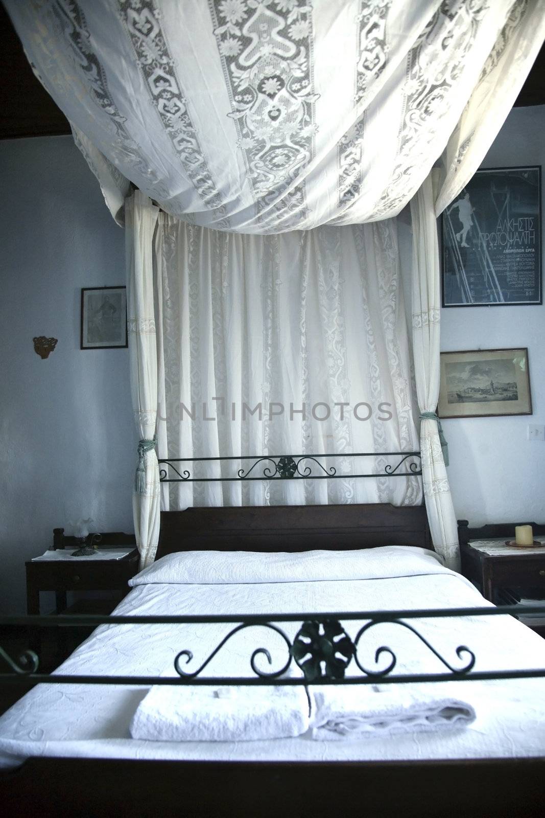 old queen size bed with white canopy