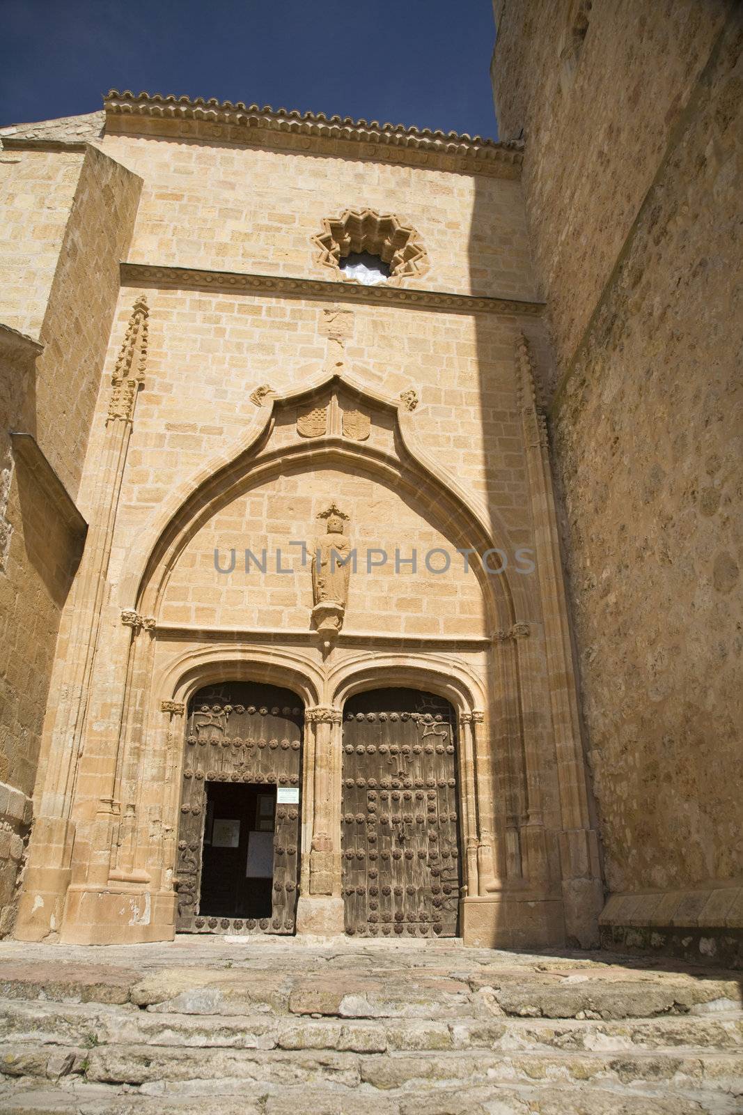 double door of belmonte village church in spain