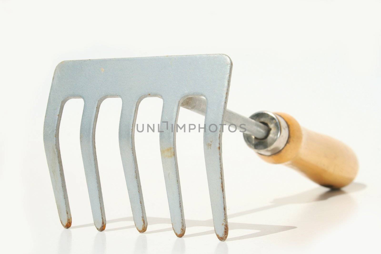 Hand rake against white background