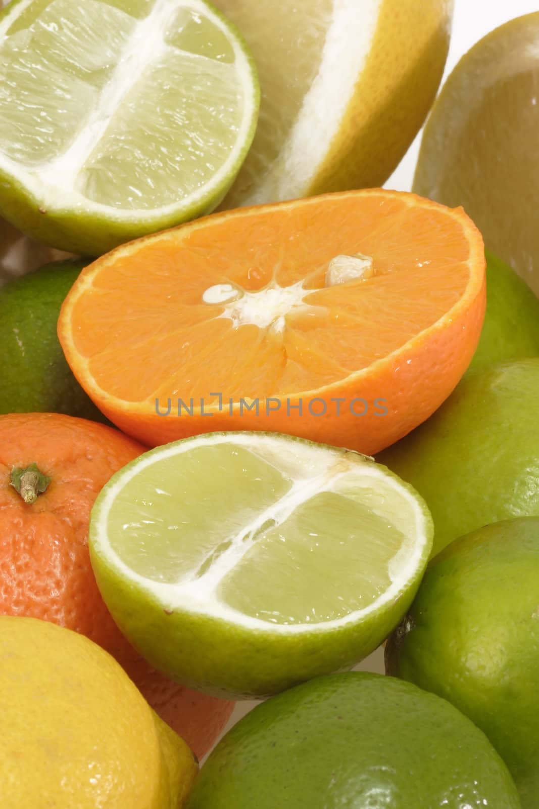 Colorful fresh and  healthy fruits on bright background