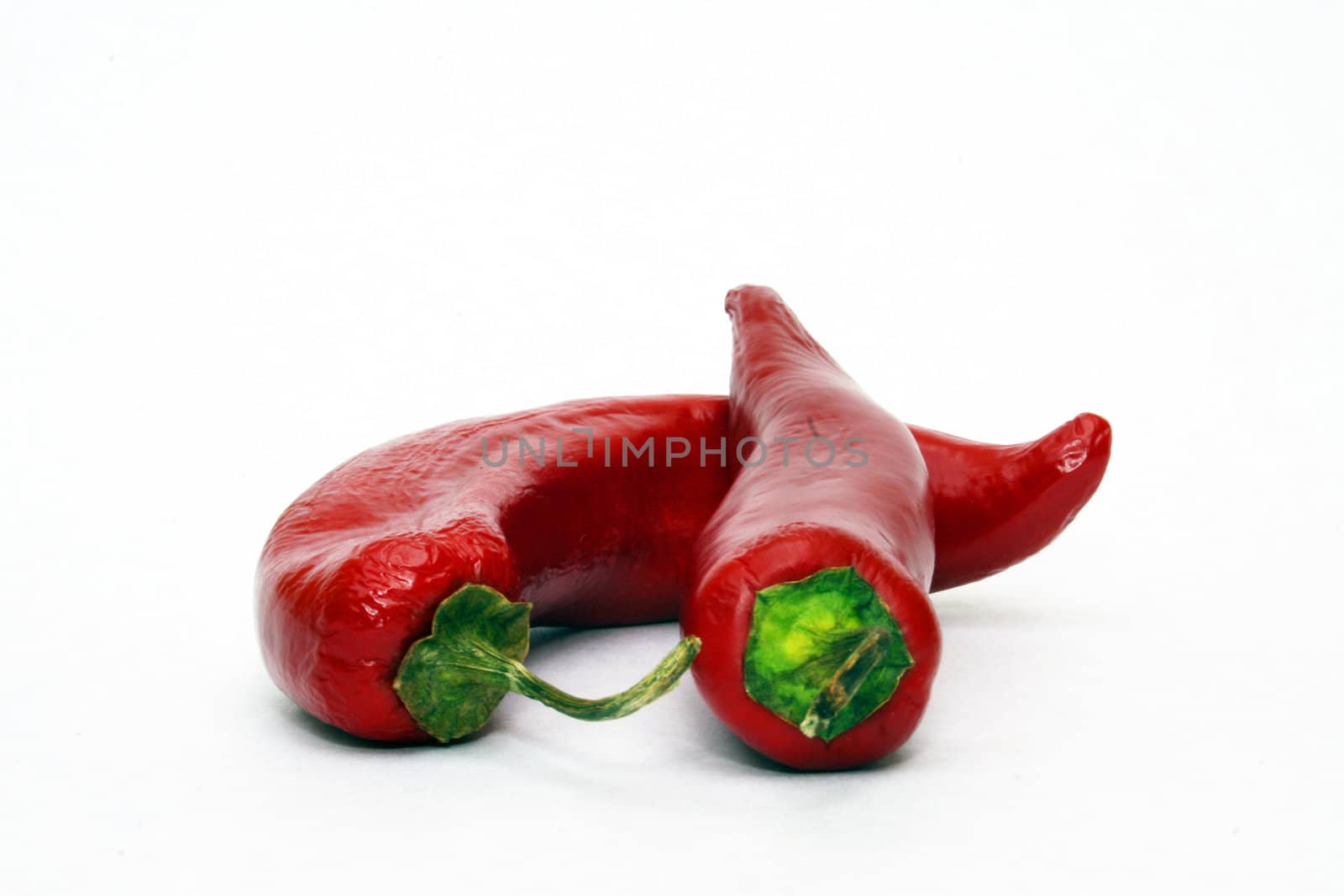 Two red peppers by timscottrom