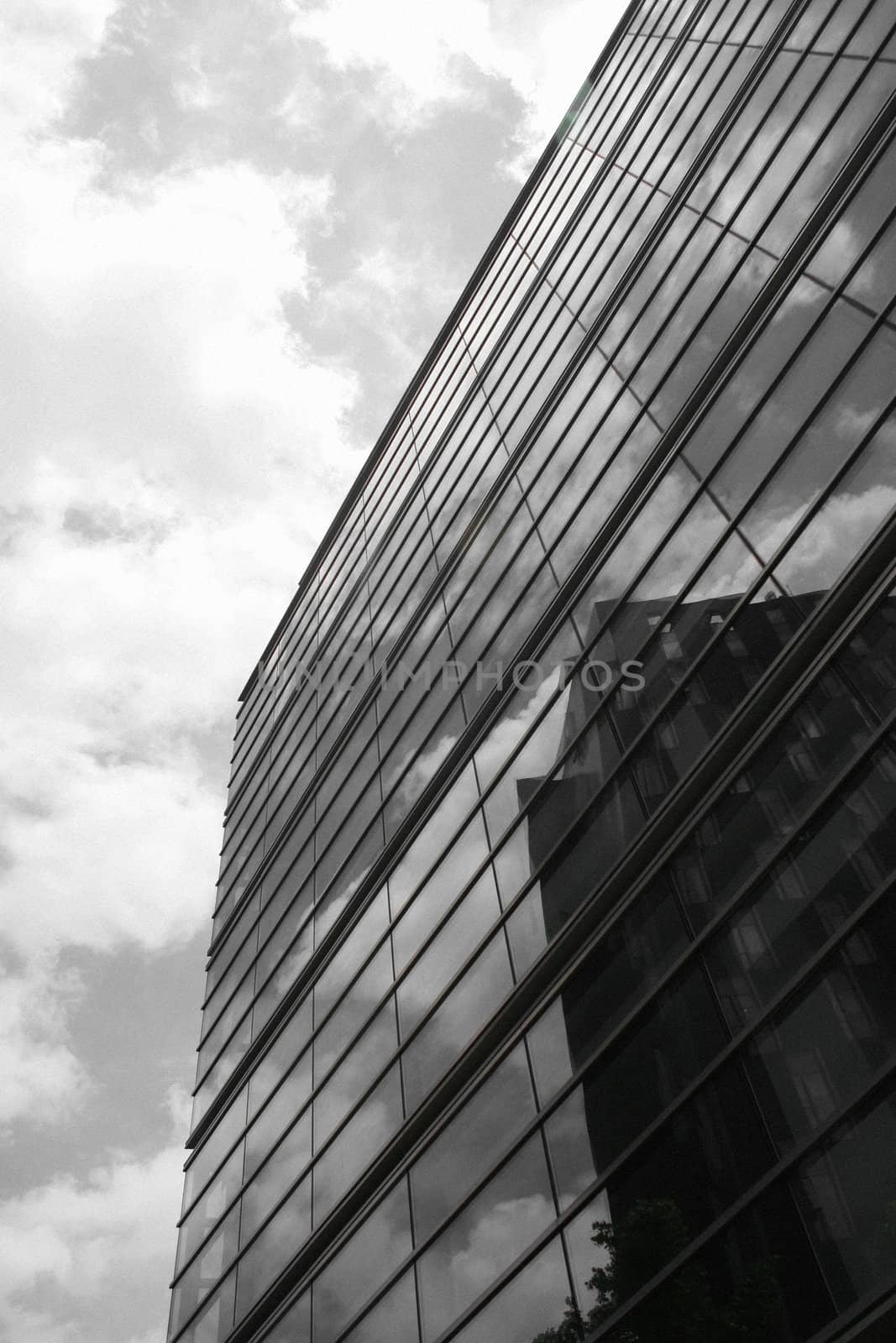 Highrise modern office building against dramatic sky
