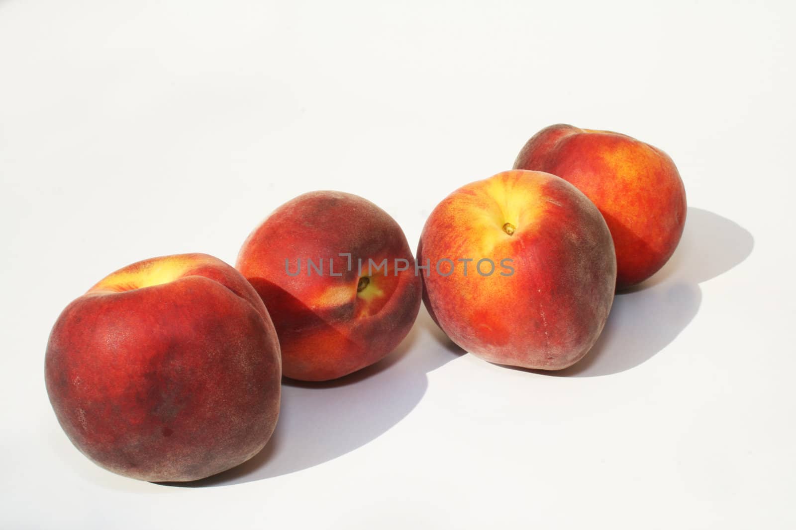 Group of peaches against white background