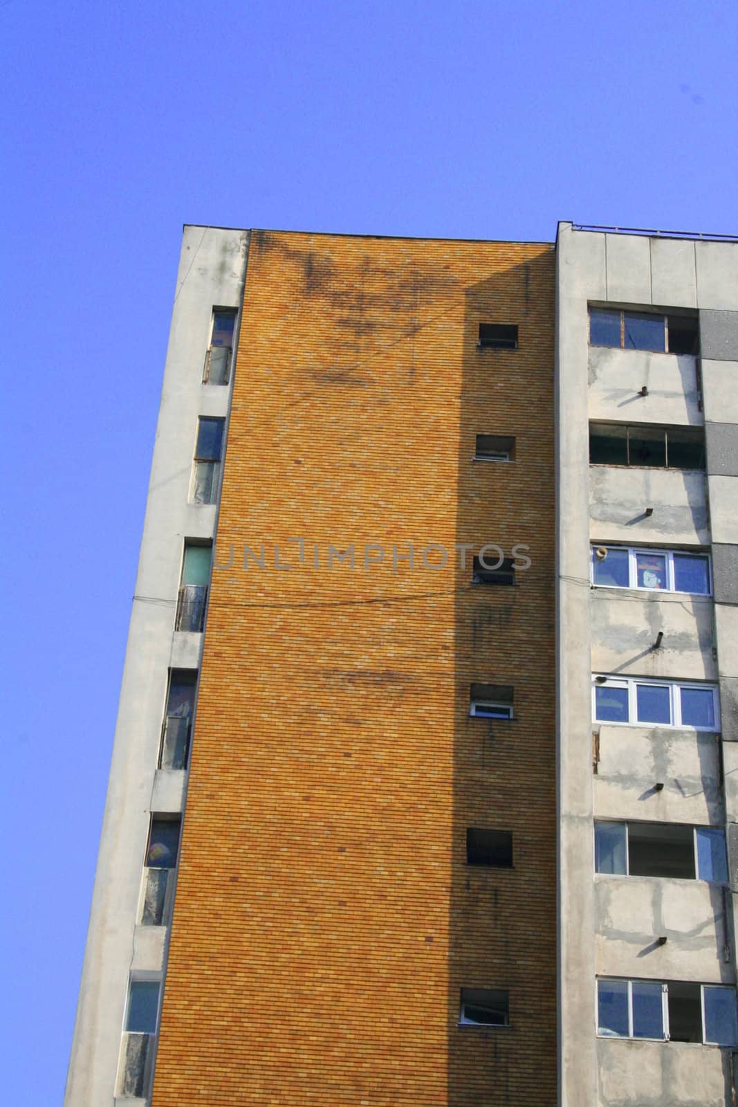 Apartment building against blue sky