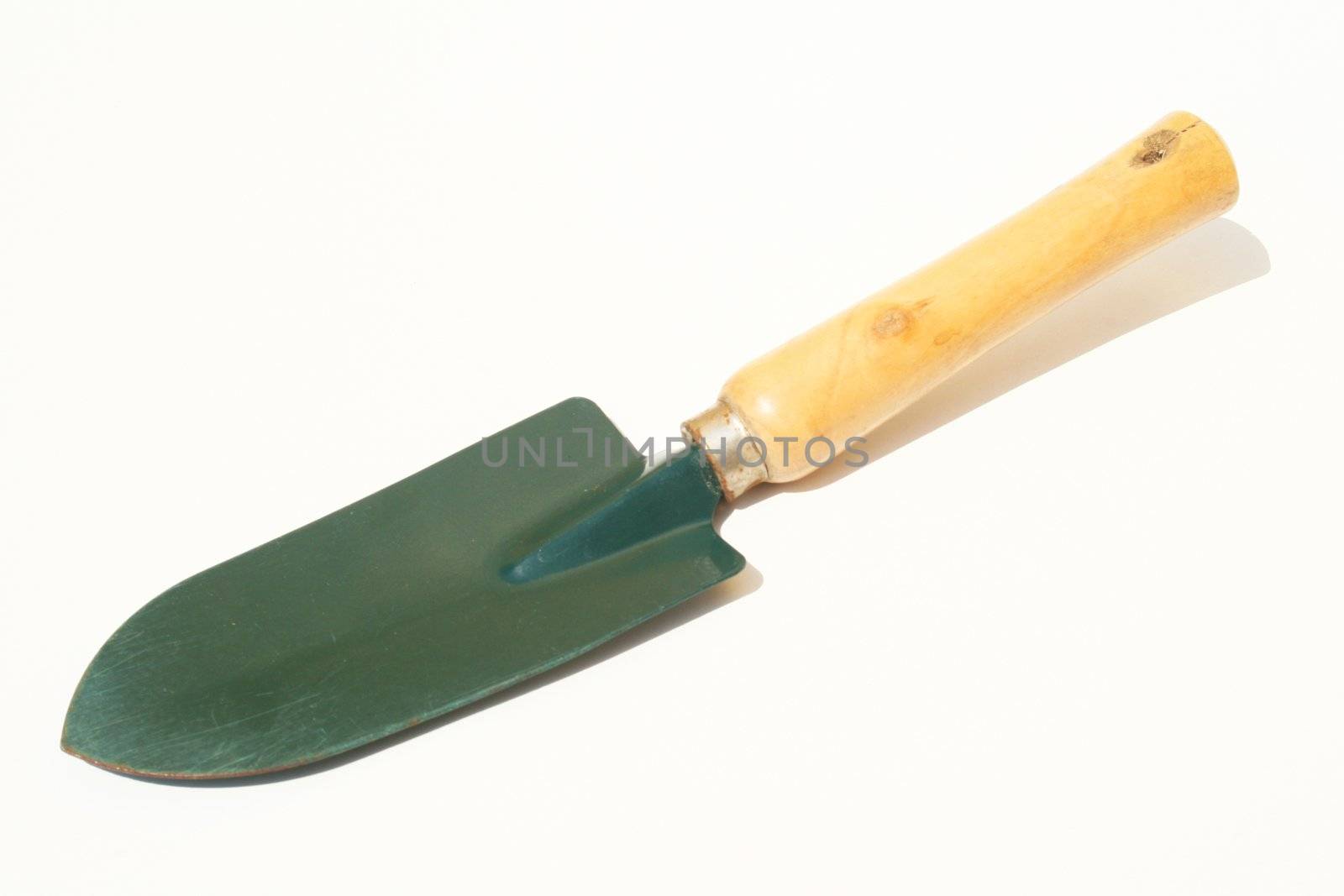 Garden trowel against white background on diagonal