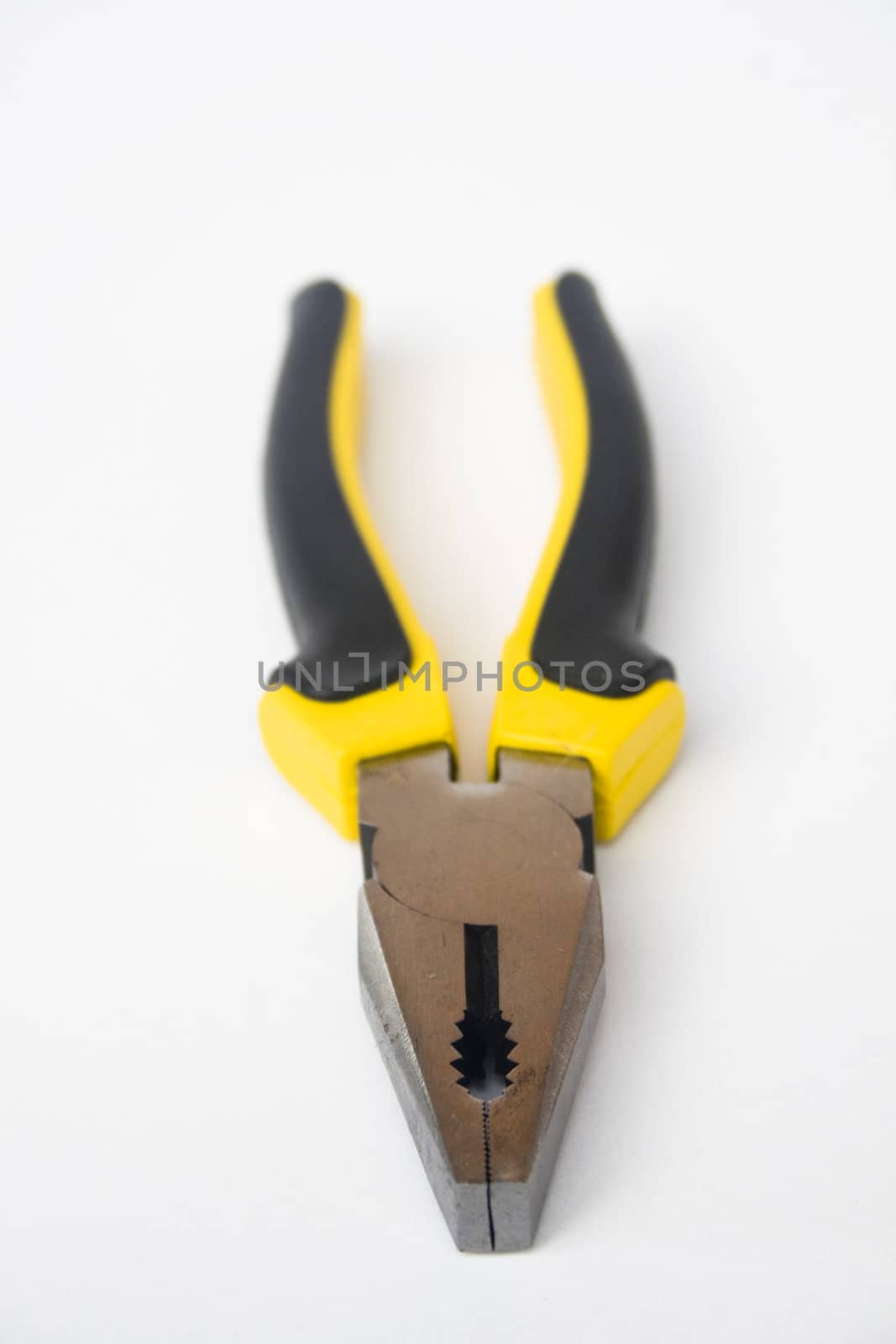 Yellow and black handled blunt nosed pliers on white background