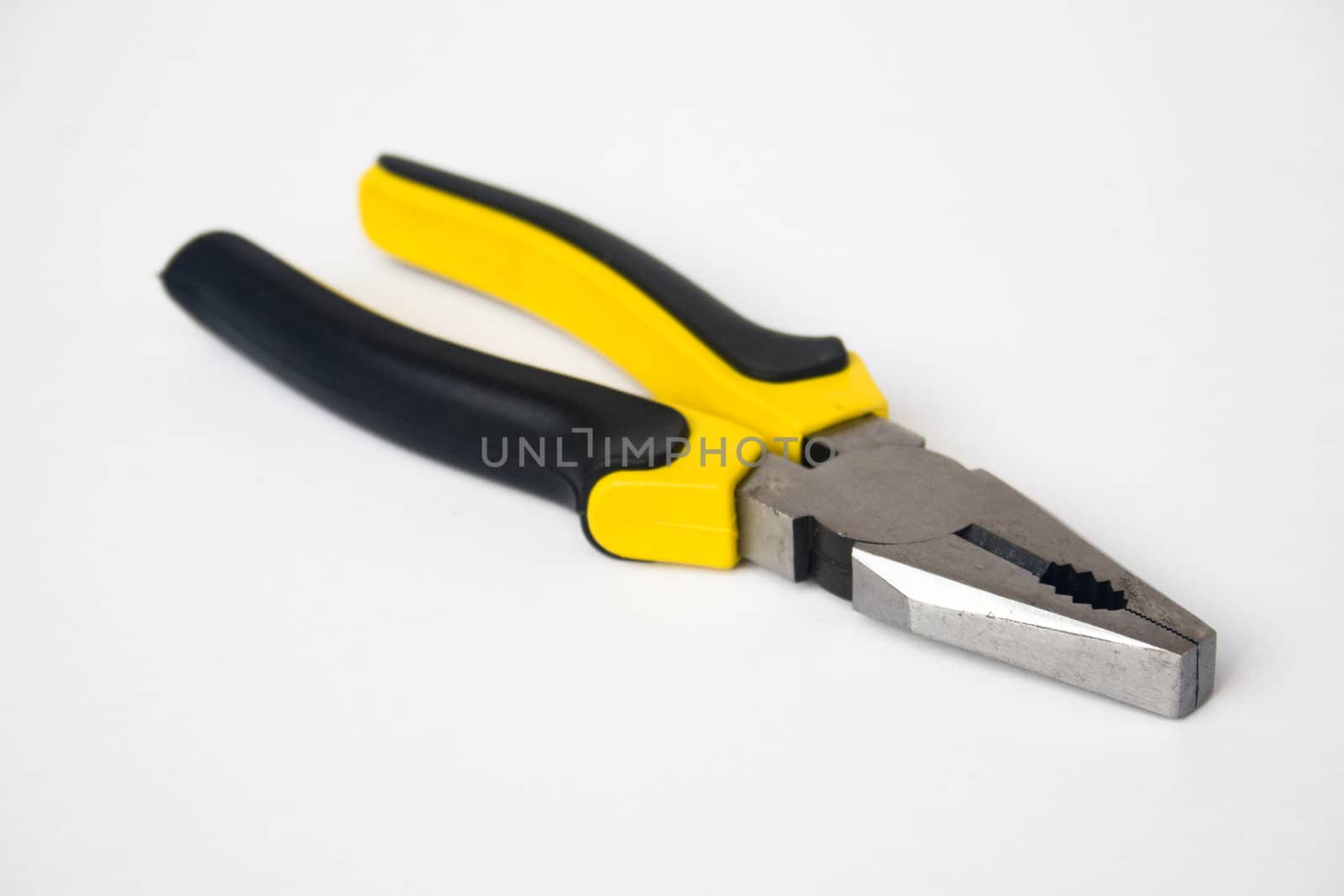 Yellow and black handled blunt nosed pliers on white background