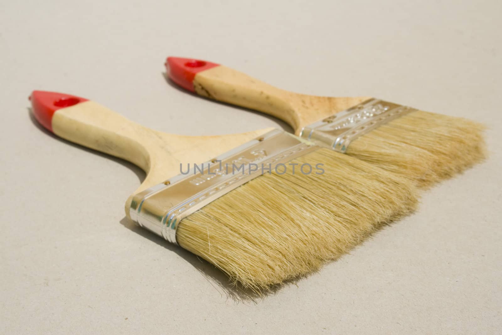 A set of paint brushes isolated against a plain background