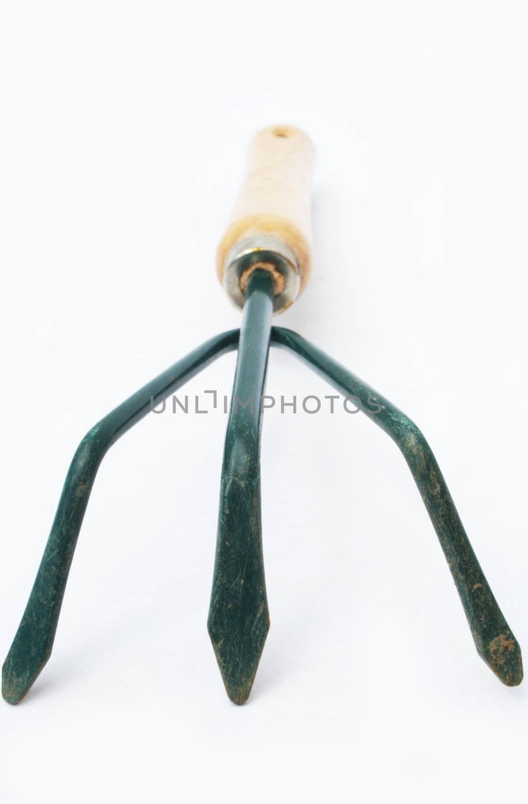 Hand rake for gardening against white background