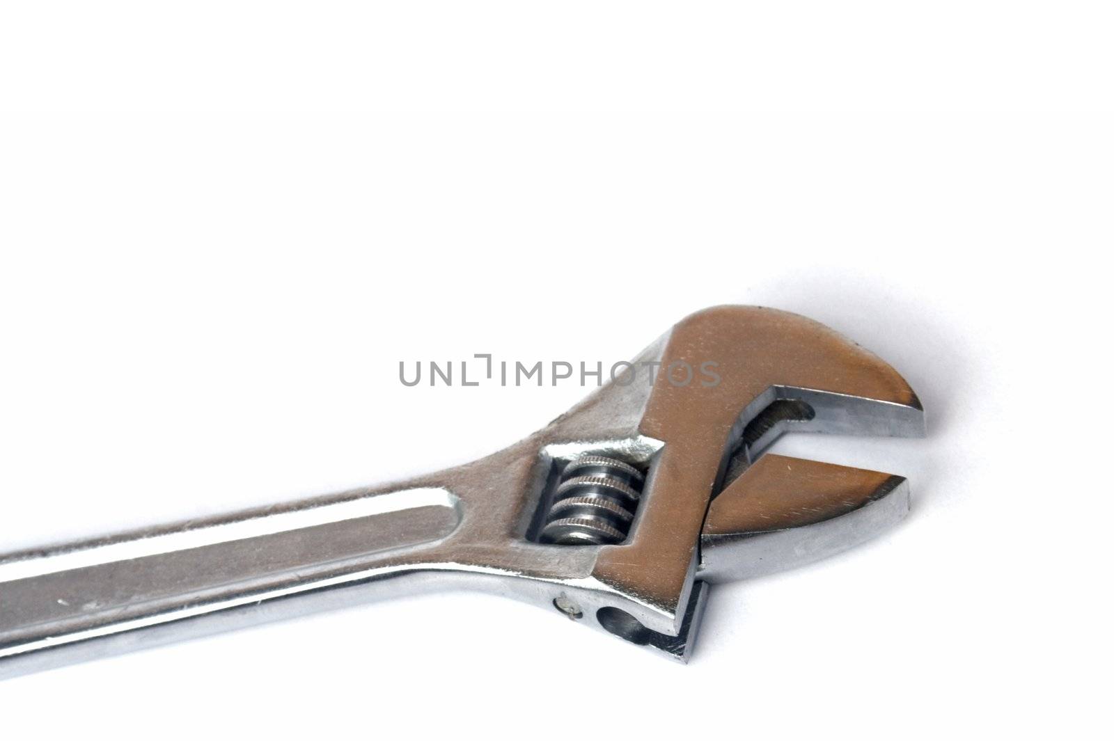 Standard chromed crescent wrench isolated against white background