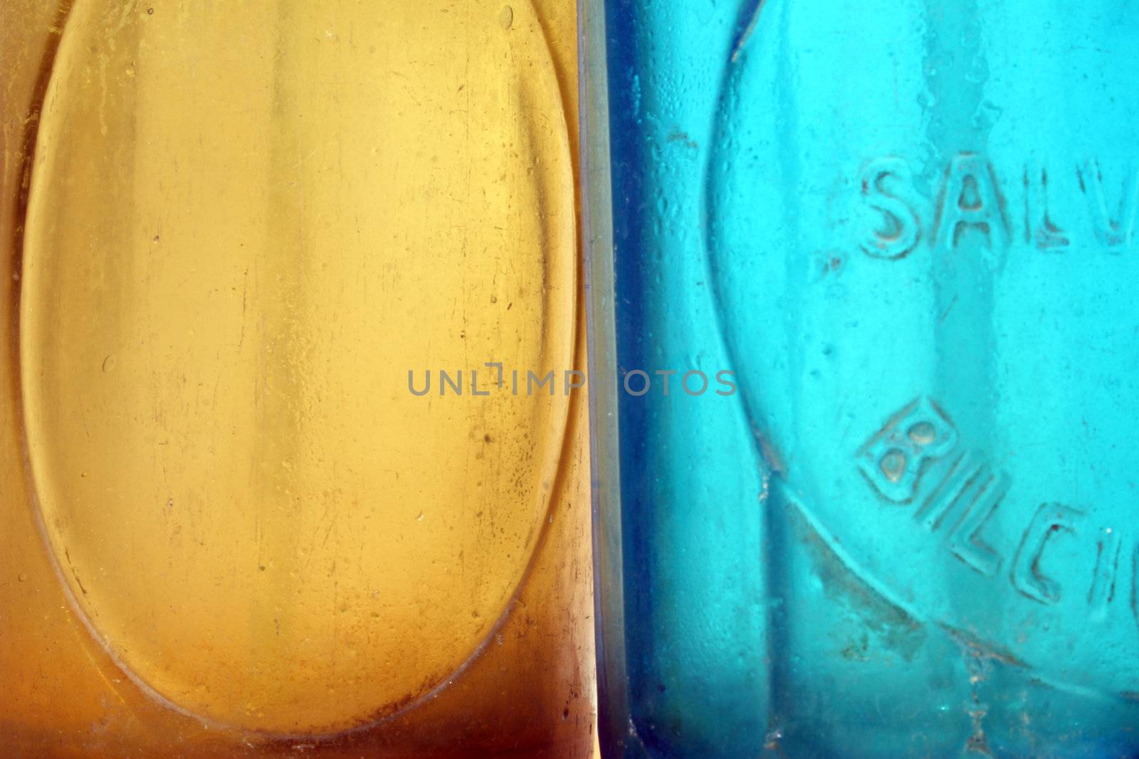 Close-up of yellow and blue seltzer bottles