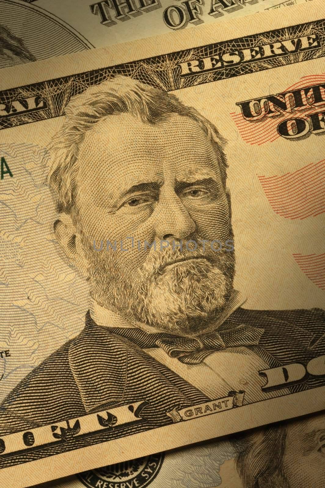 Close-up of Ulysses S. Grant on the $50 bill, dramatically lit.