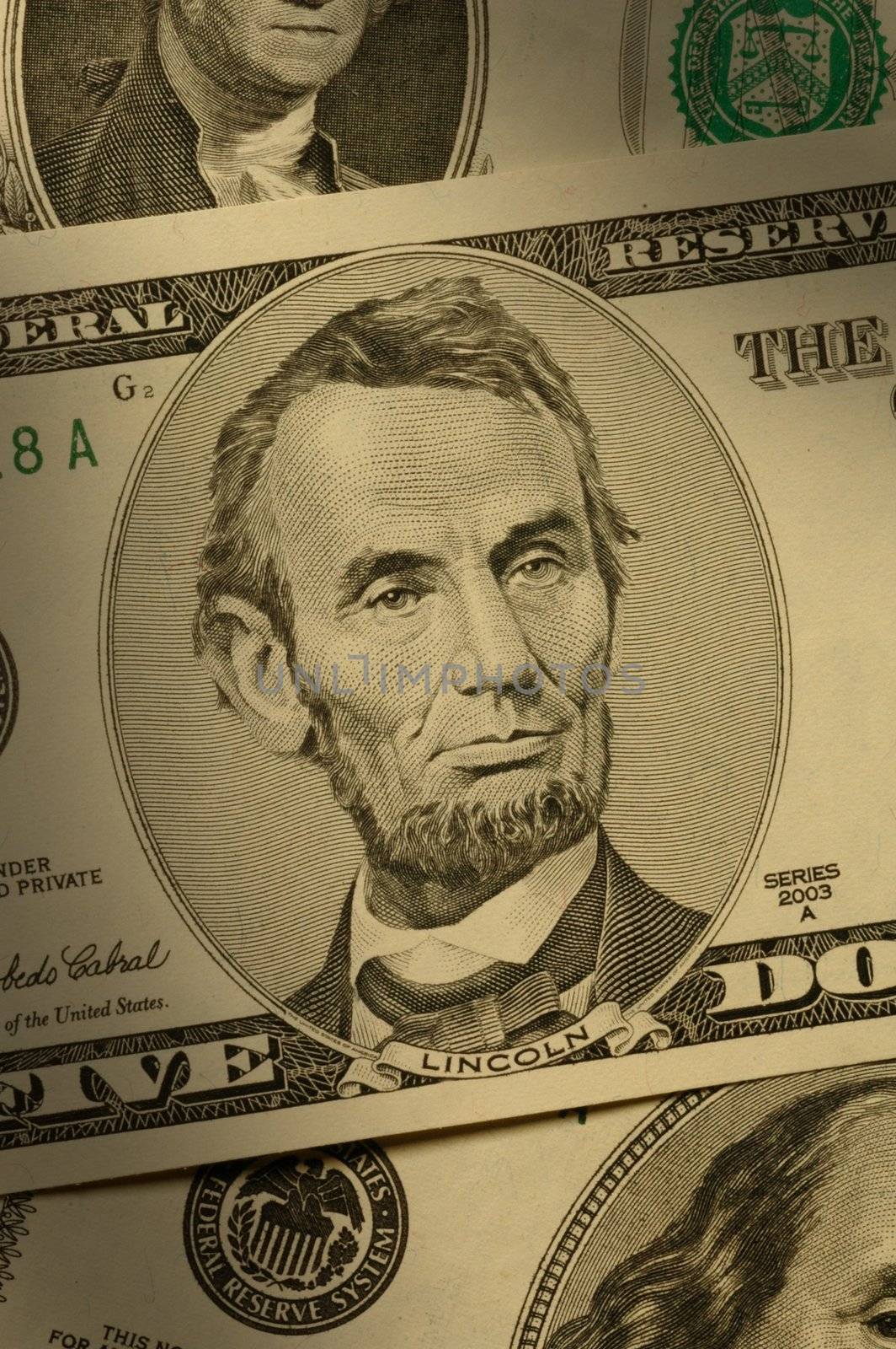Close-up of Abraham Lincoln on the $5 bill by Balefire9