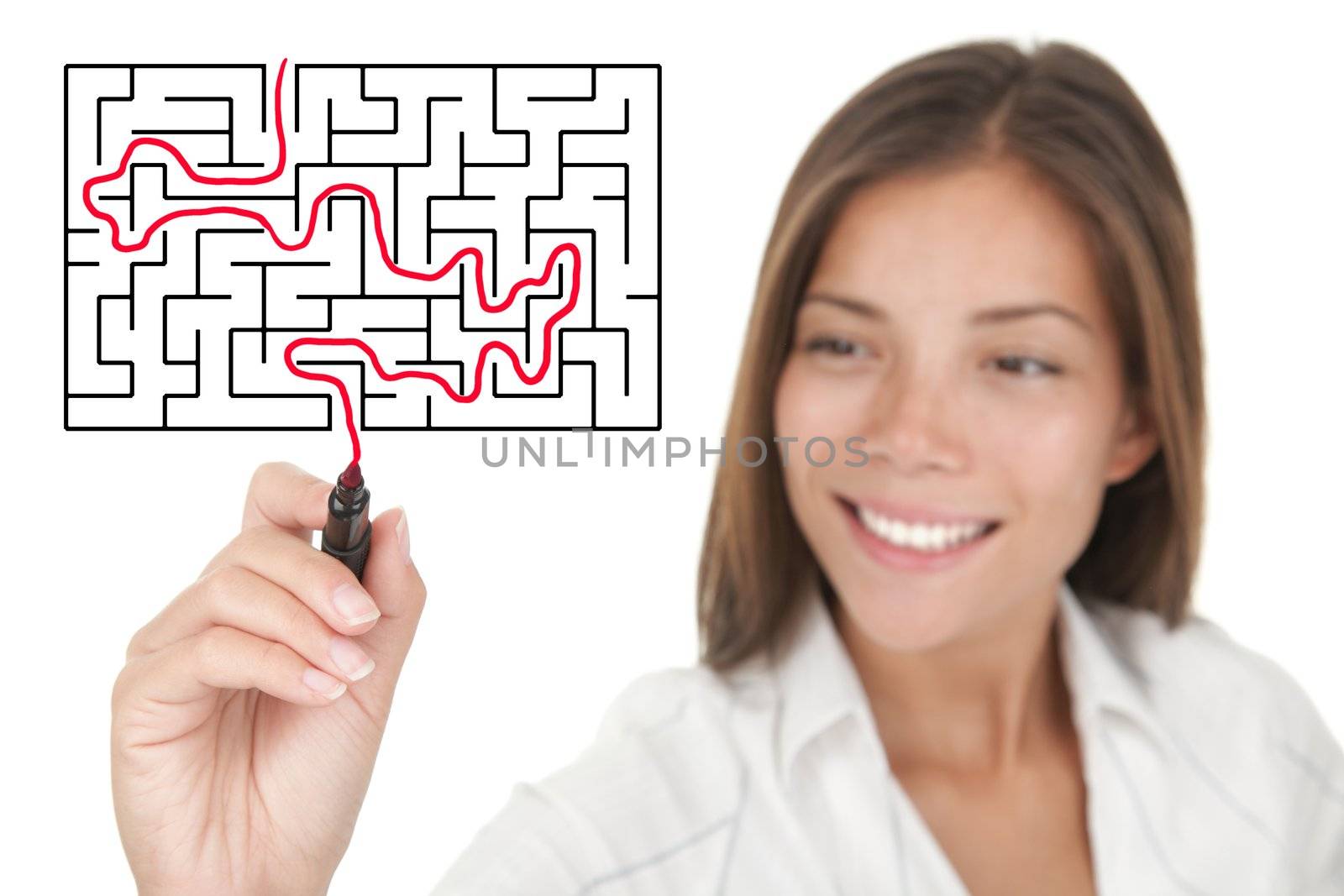 Businesswoman solving maze / labyrinth problem.