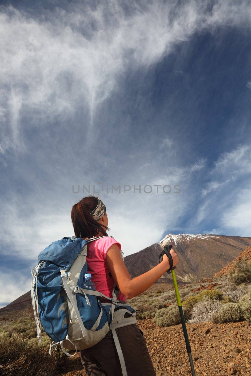 Hiking. Woman hiker looking at the adventure ahead. Lot's of copy-space. Photo is from the volcano Teide, Tenerife, Canary Islands, Spain