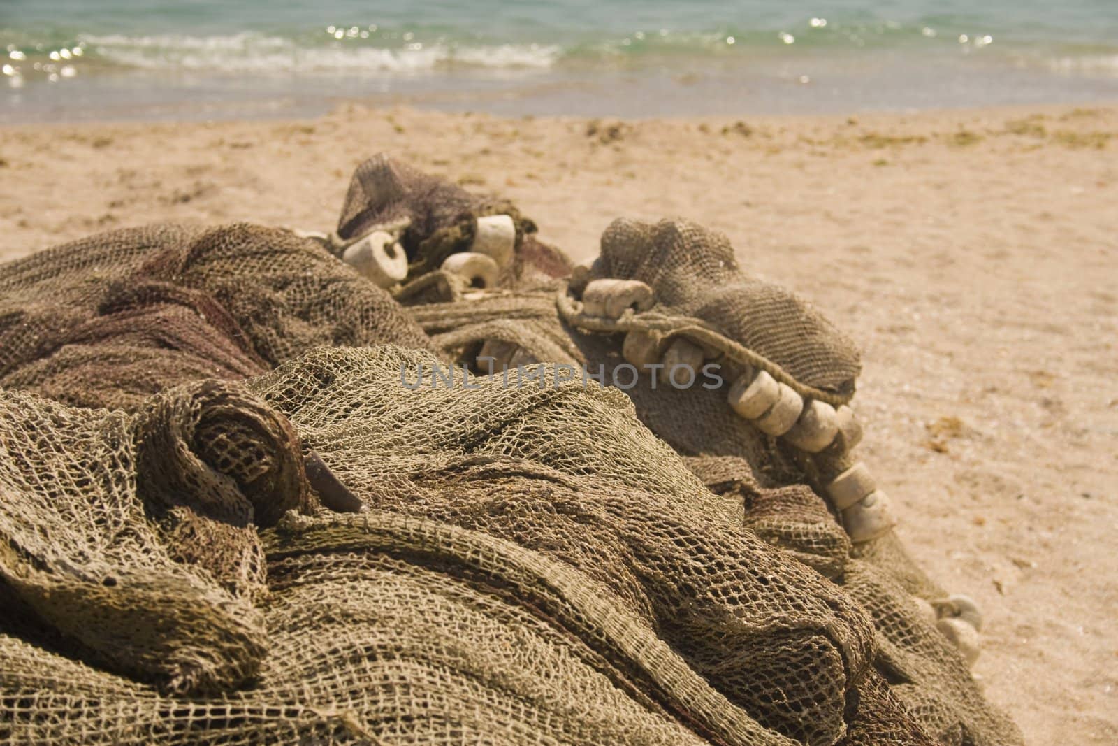 Close-up of fishing nets on beach