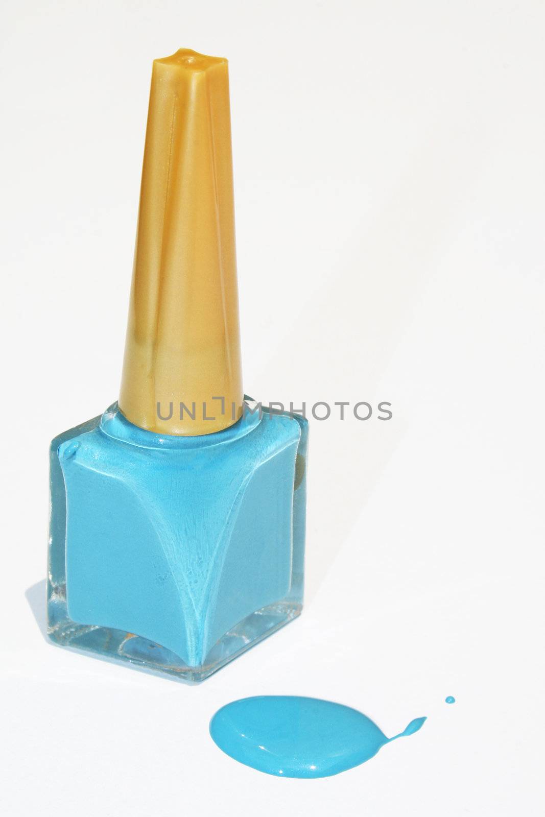 Blue nail polish bottle isolated against white background