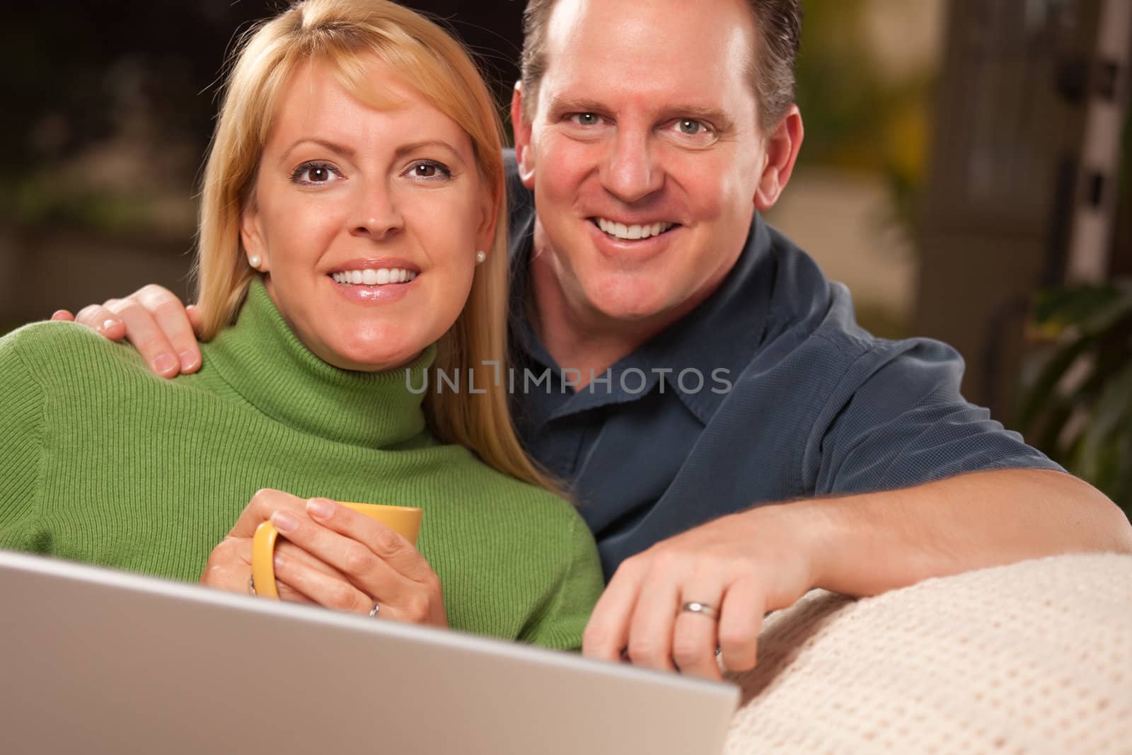 Handsome Couple Using Laptop by Feverpitched