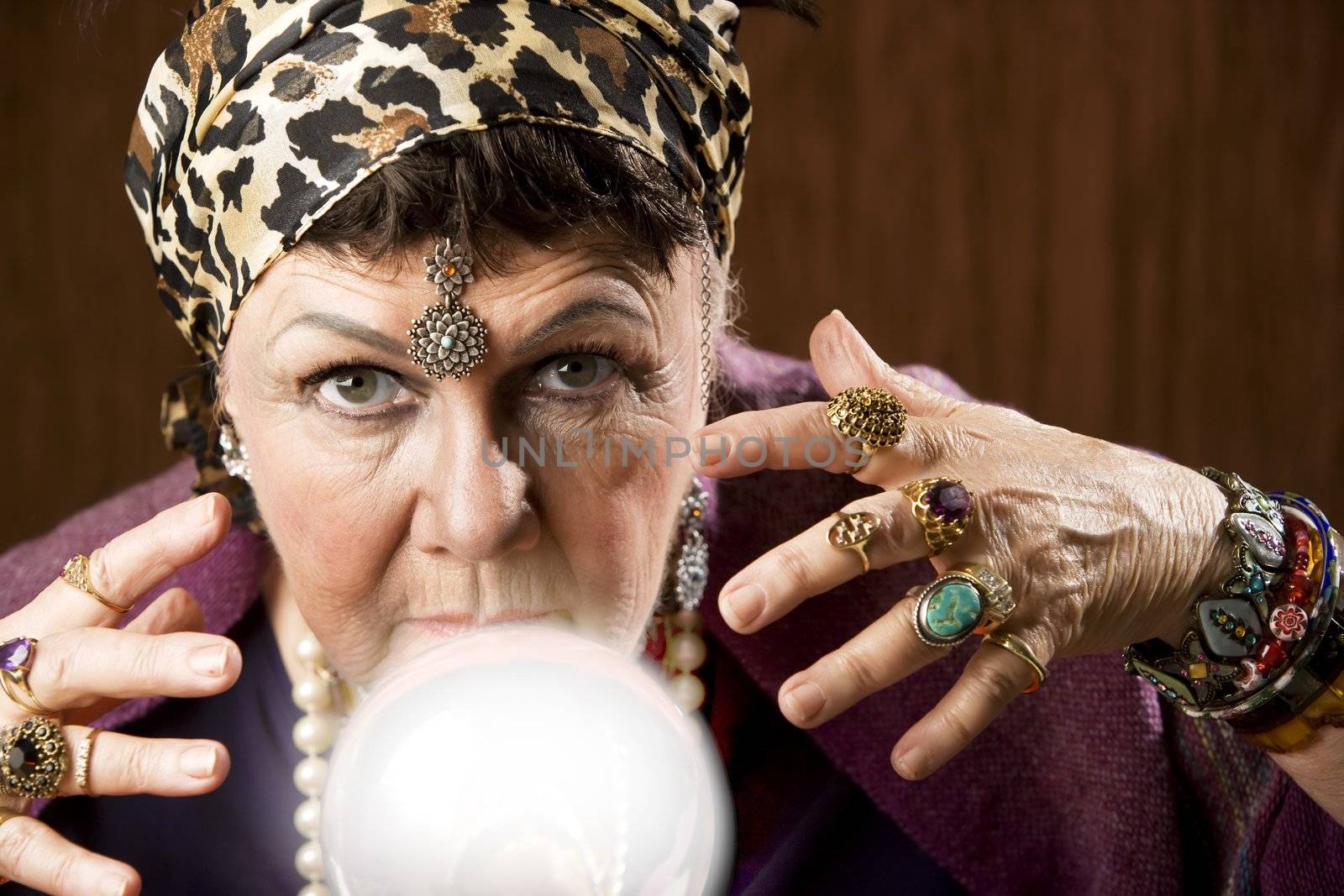 Female gypsy fortune teller with a crystal ball