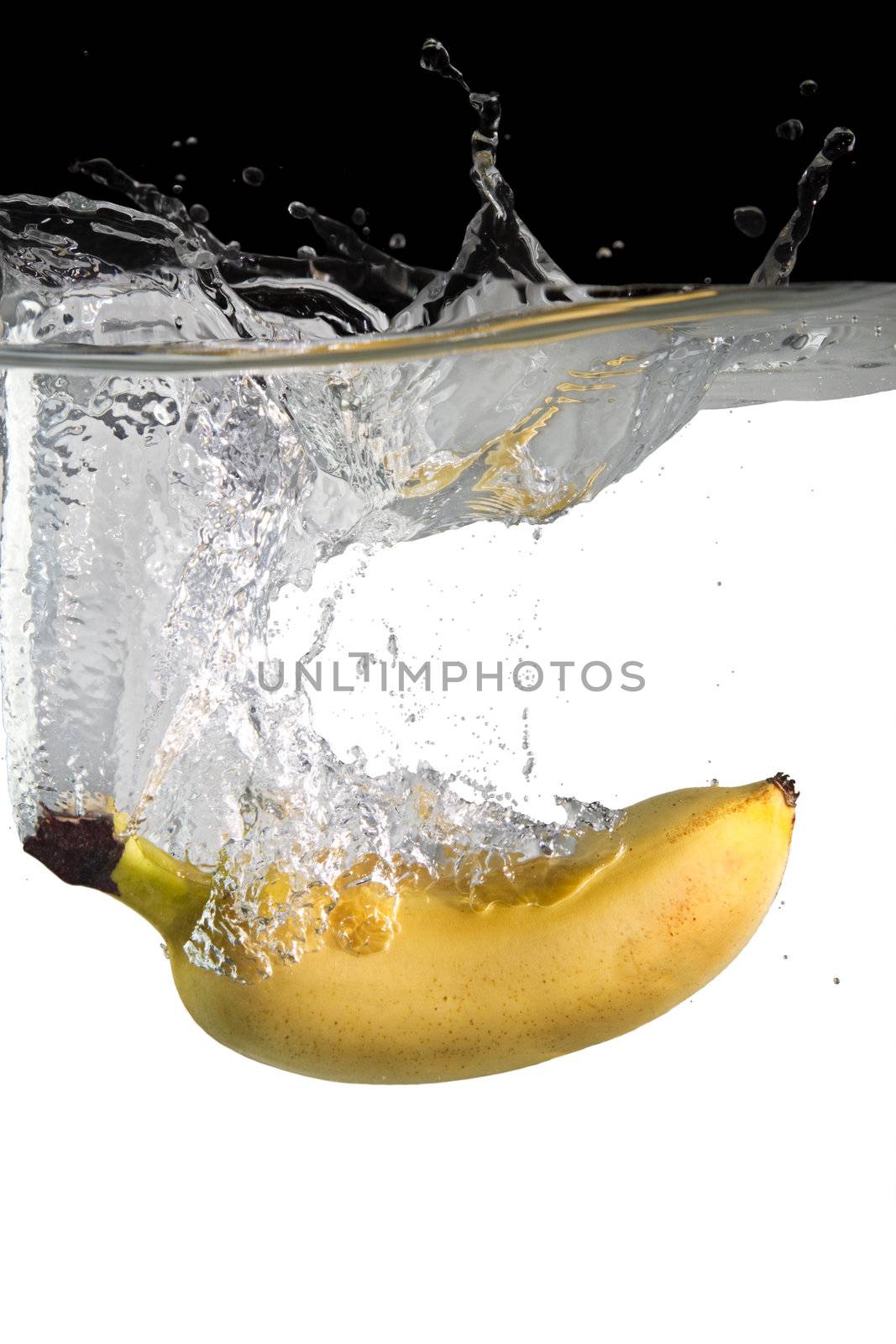 banana thrown in water with black and white background