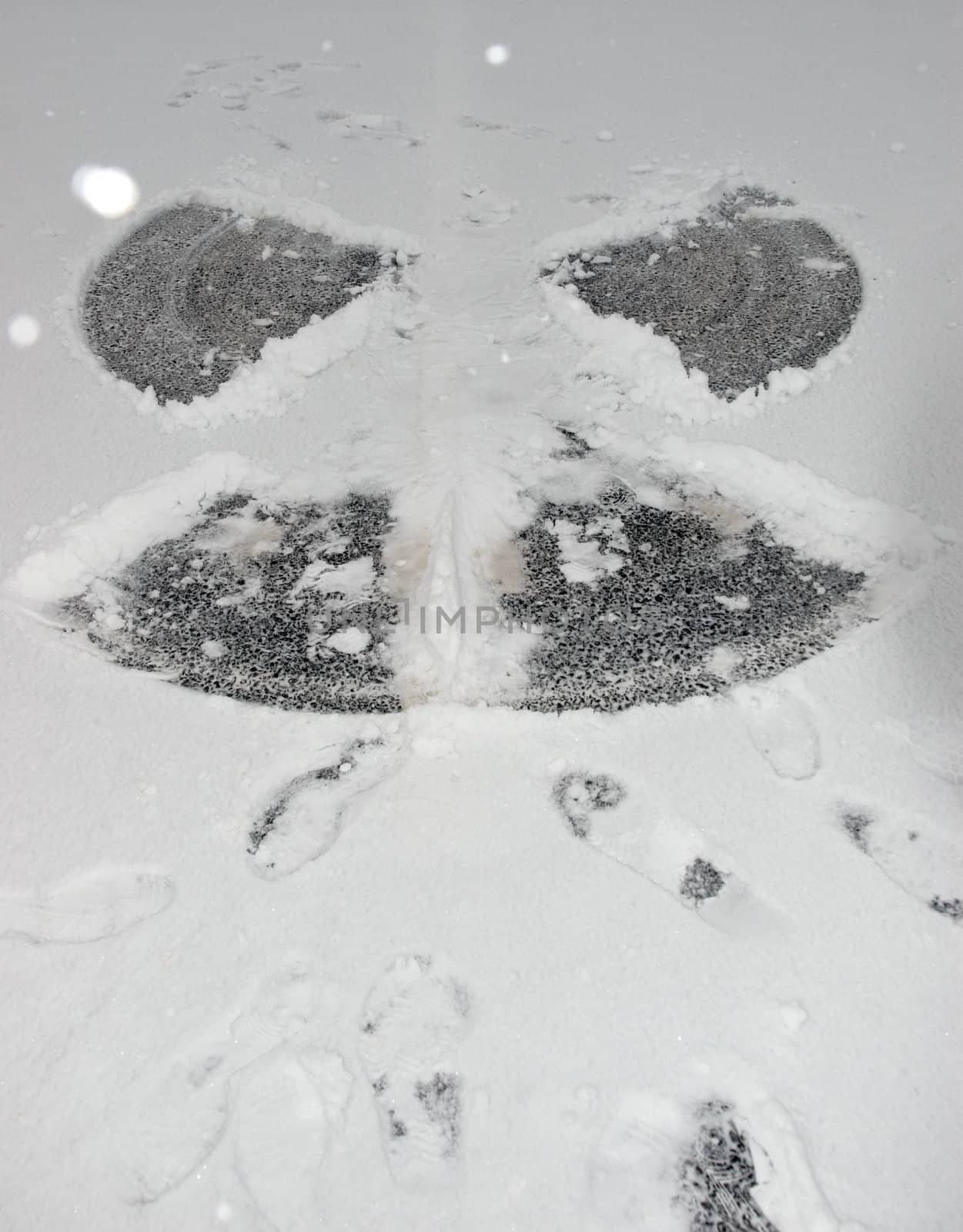 a snow angel on the road surface