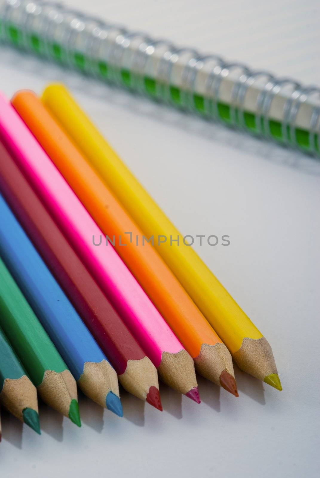 Closeup of colored crayons on white background