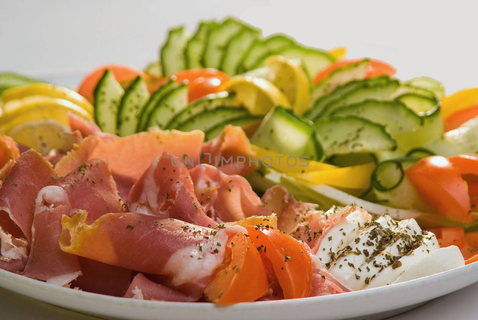 Closeup of cold meat and fresh vegetables