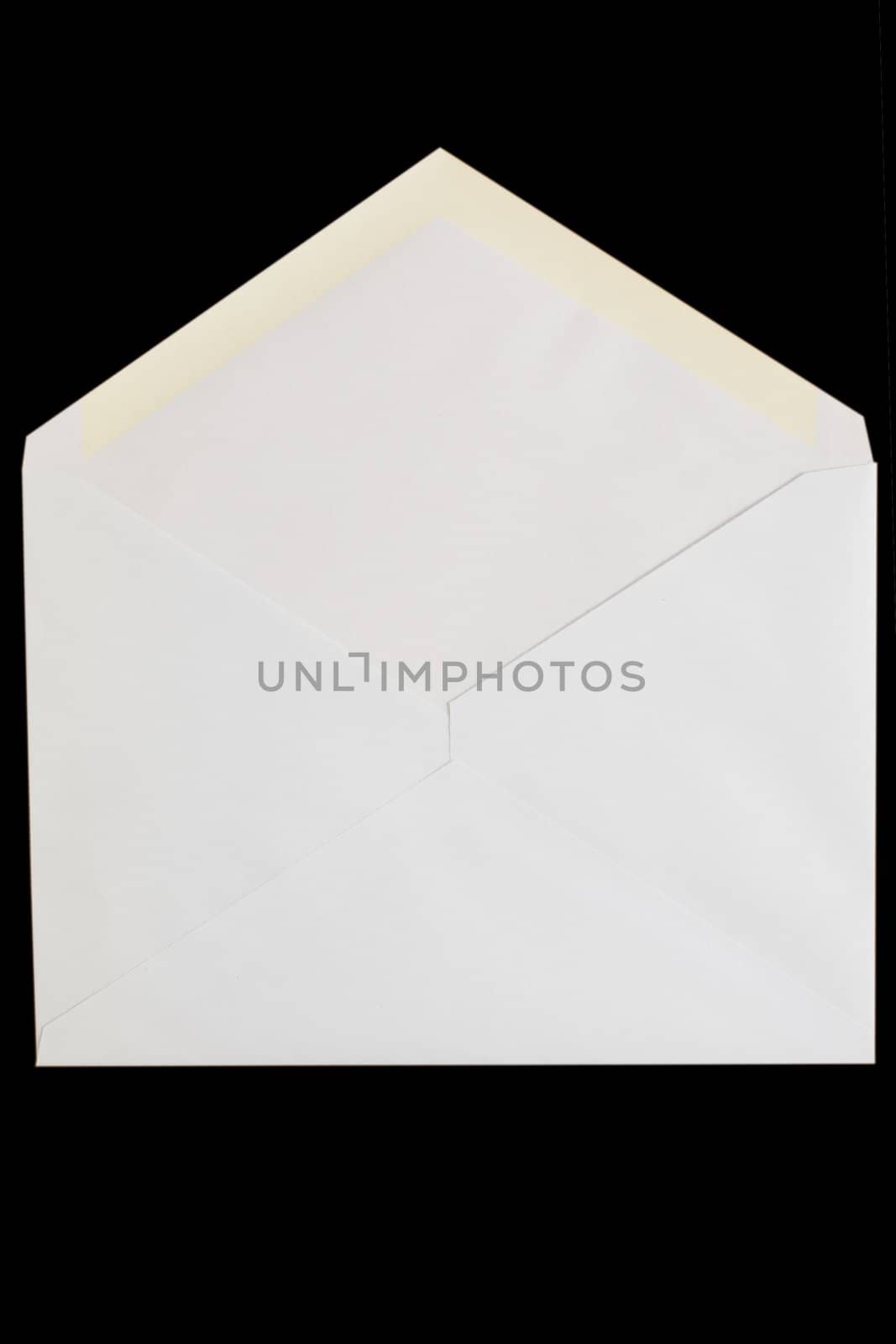 front view of white open envelop on black background