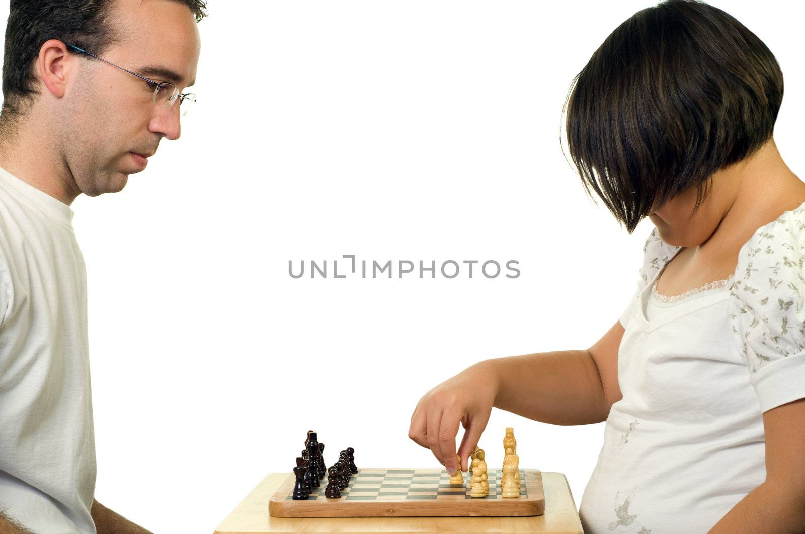 A father and his daughter playing a game of chess