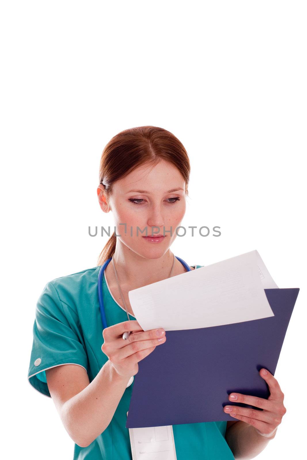 Caucasian woman in medical uniform looking at her report on the clipboard